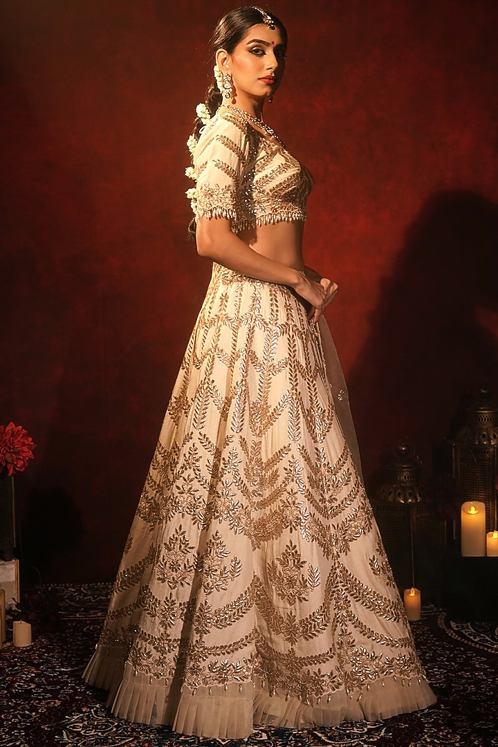 Ivory Raw Silk Embroidered Bridal Lehenga Set by Archana Kochhar at Pernia's Pop Up Shop