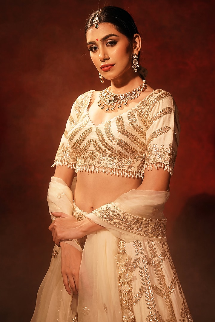Ivory Raw Silk Embroidered Bridal Lehenga Set by Archana Kochhar at Pernia's Pop Up Shop