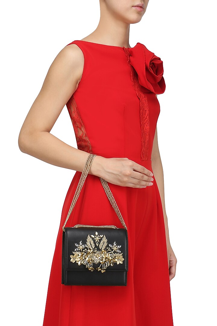 Studio Accessories presents Black and gold crystal and sequins floral motif clutch available only at Pernia's Pop Up Shop.