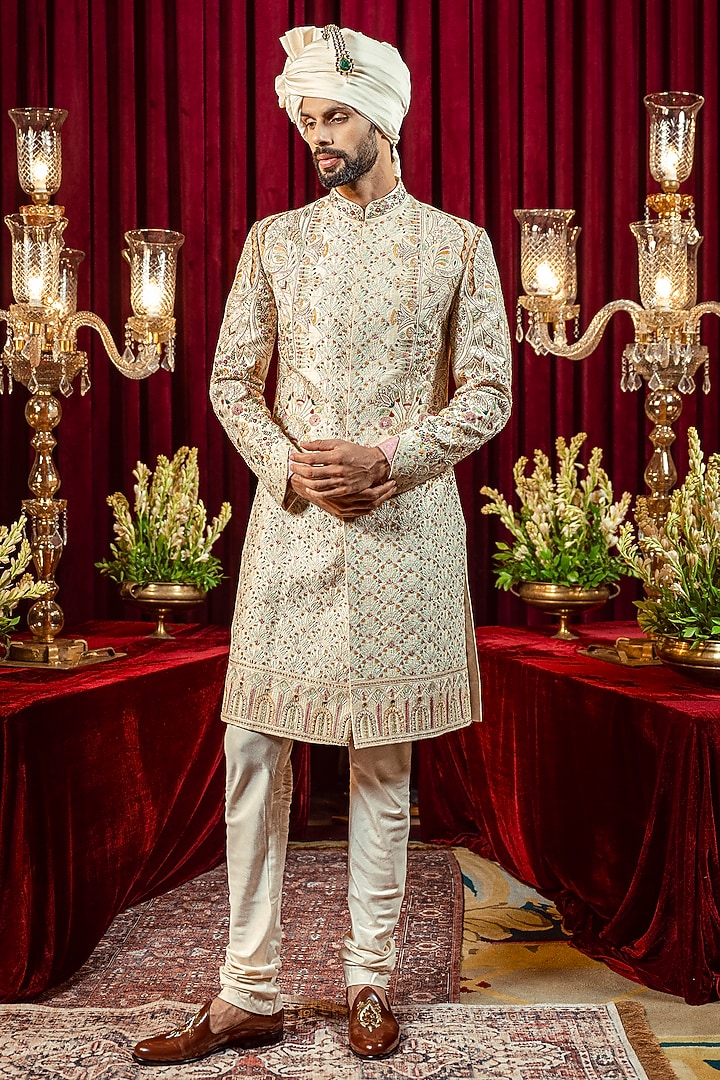 Ivory & Gold Raw Silk Resham Embroidered Groom Sherwani Set by ADANI at Pernia's Pop Up Shop