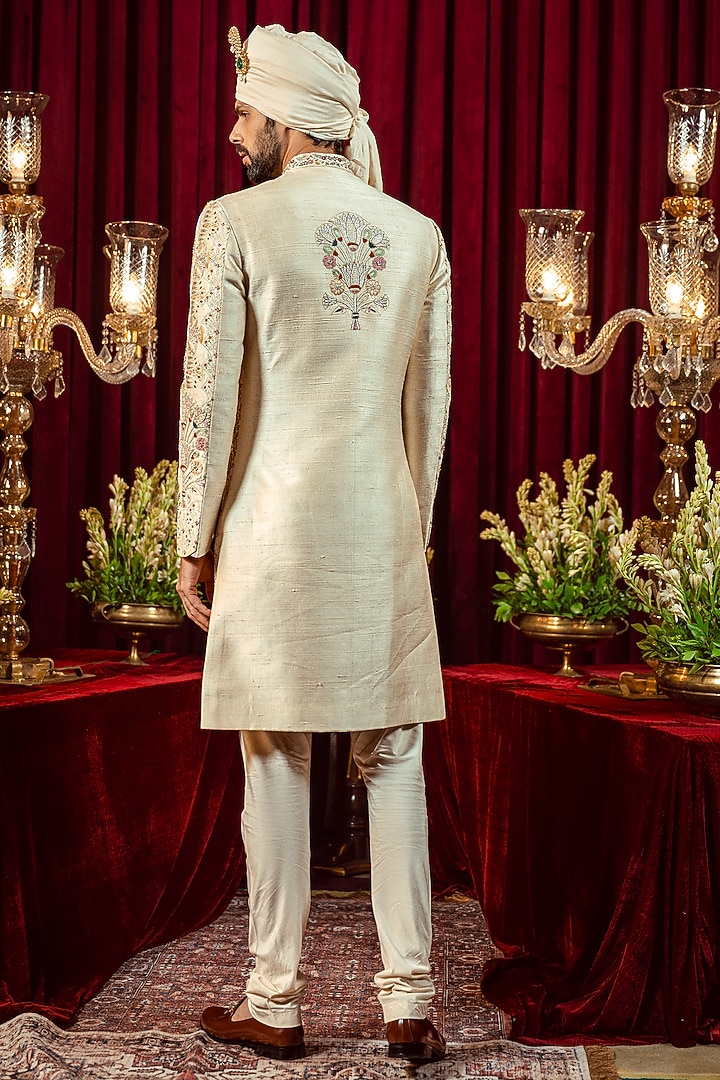 Ivory & Gold Raw Silk Resham Embroidered Groom Sherwani Set by ADANI at Pernia's Pop Up Shop