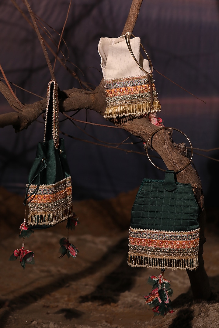 Ivory Satin Tasseled Quilted Potli by Aditi Gupta at Pernia's Pop Up Shop