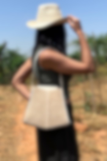 Beige Raffia & Leather Bucket Bag by ADISEE at Pernia's Pop Up Shop