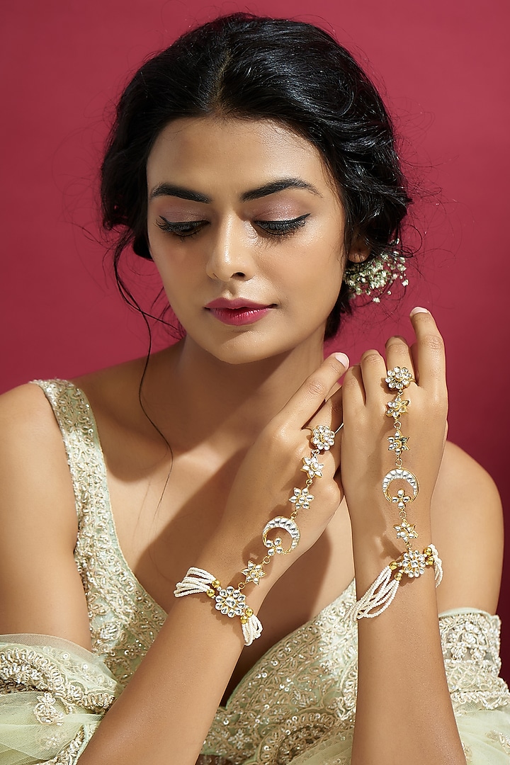 Gold Finish White Kundan Polki Hathphool (Set Of 2) by Adityam Jewels at Pernia's Pop Up Shop