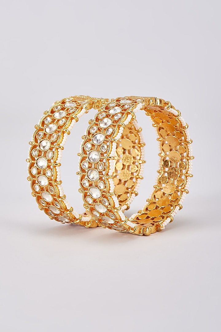 Gold Finish White Kundan Polki Bangles (Set Of 2) by Adityam Jewels at Pernia's Pop Up Shop