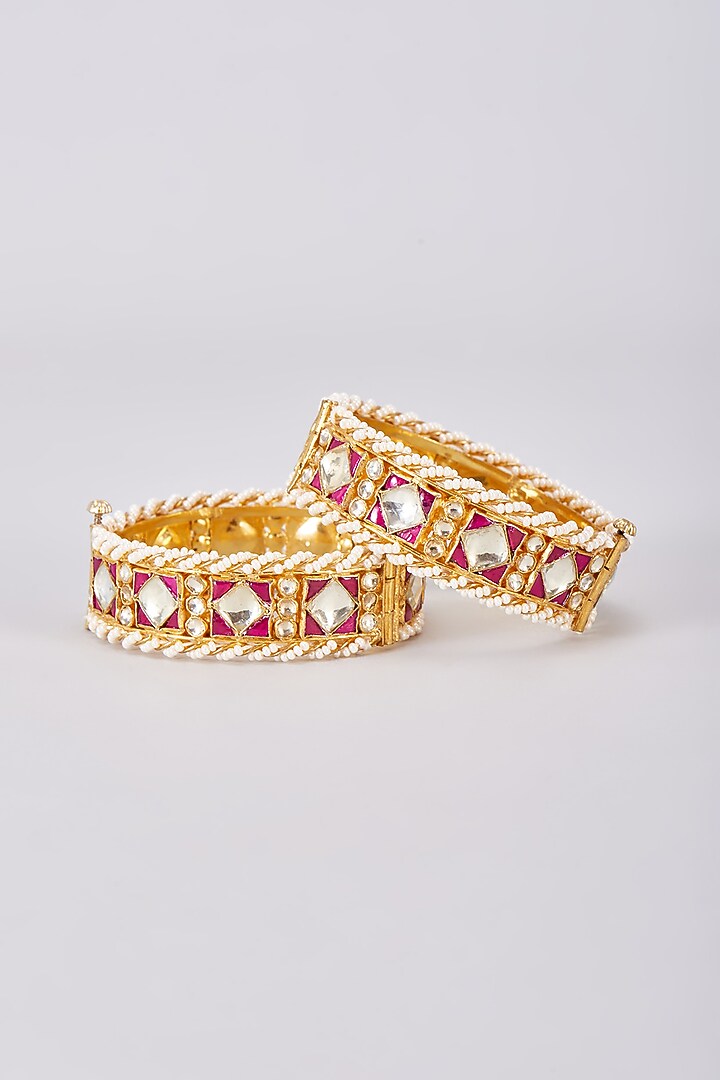 Gold Finish Red Kundan Polki Bangles (Set Of 2) by Adityam Jewels at Pernia's Pop Up Shop