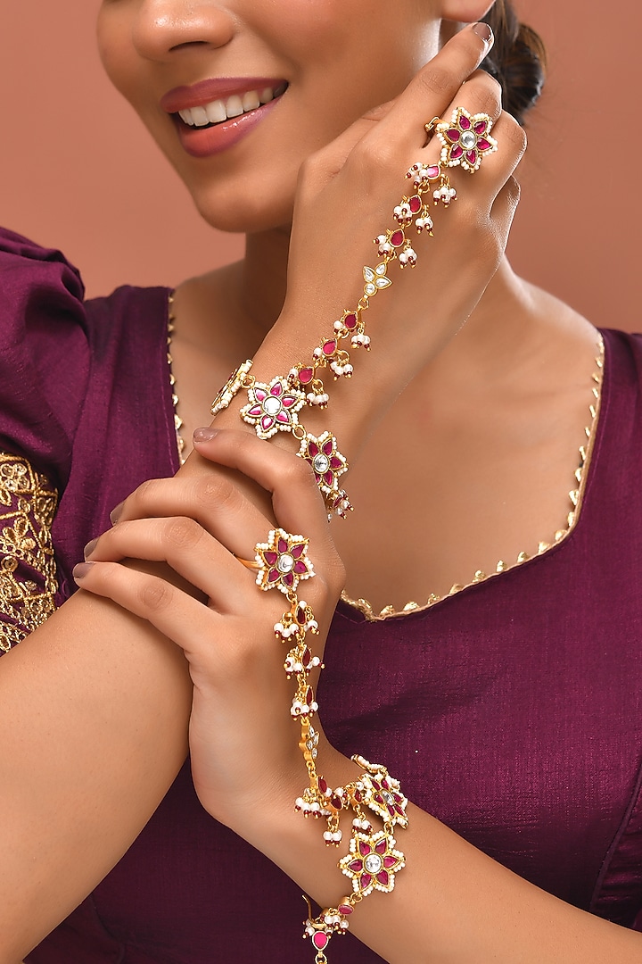 Gold Finish Red Kundan Polki Haathphools (Set Of 2) by Adityam Jewels at Pernia's Pop Up Shop