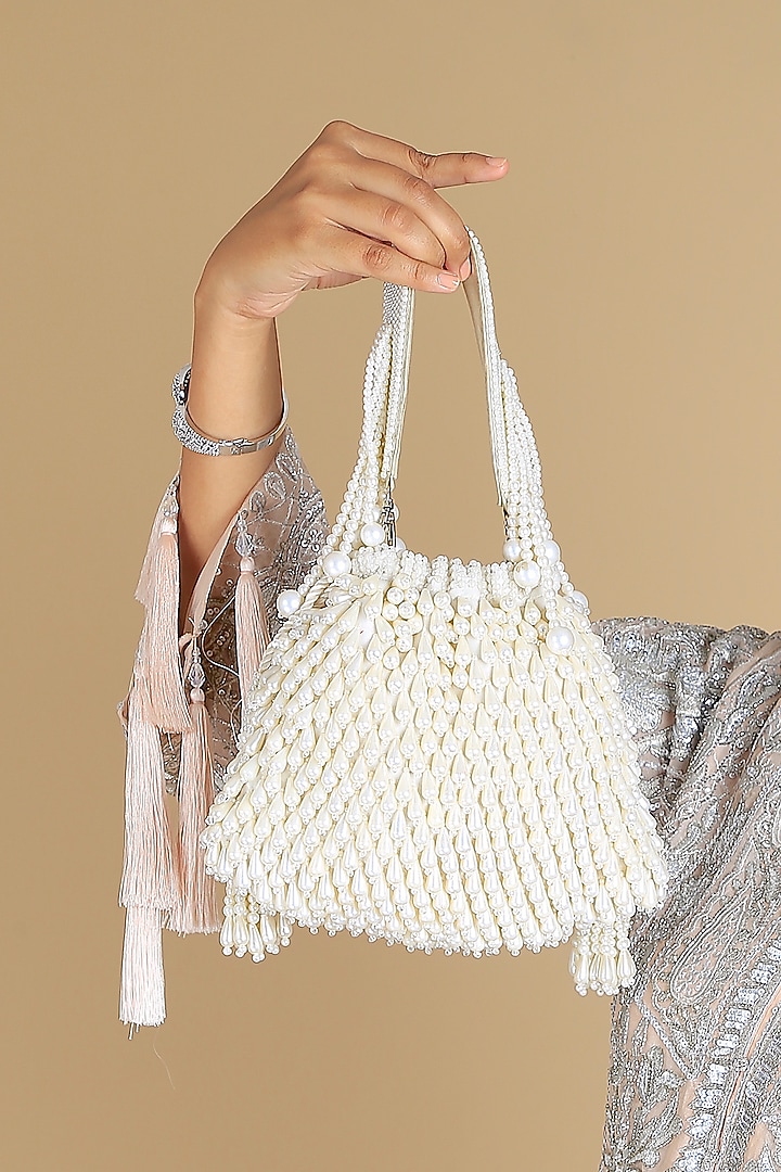 Cream Poly Silk Pearl Embellished Potli Bag by Adora by Ankita at Pernia's Pop Up Shop