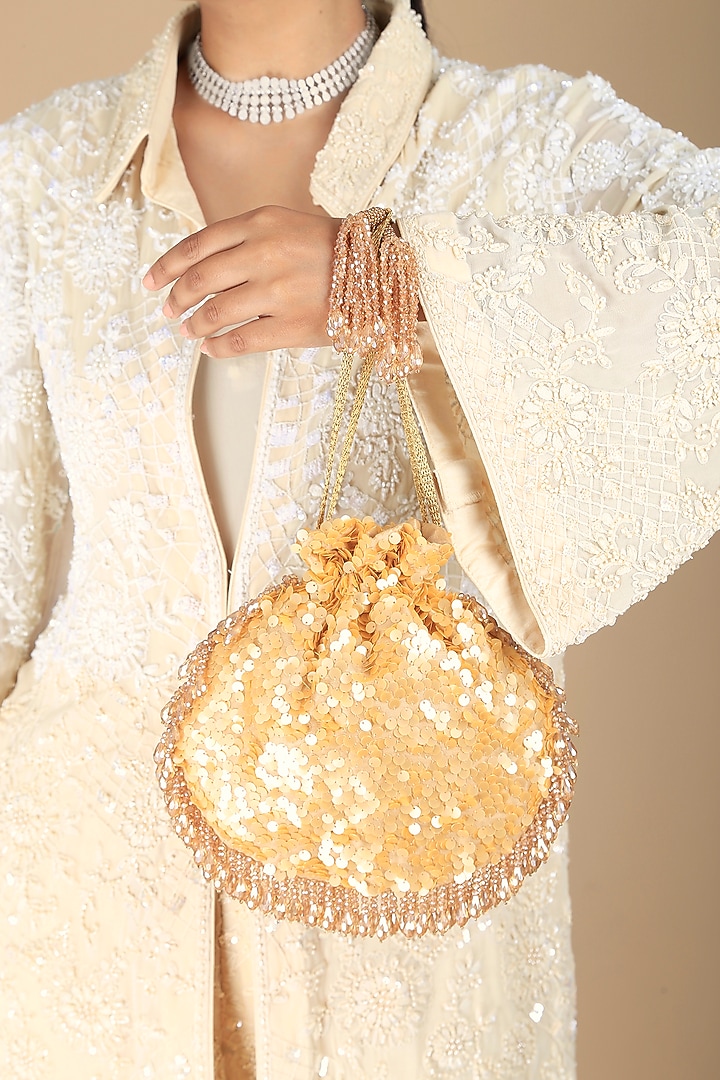 Gold Poly Silk Sequins Embroidered Potli Bag by Adora by Ankita at Pernia's Pop Up Shop