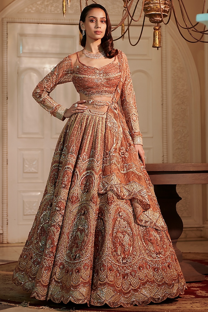 Rust Raw Silk & Net Embroidered Lehenga Set by Adaara Couture
