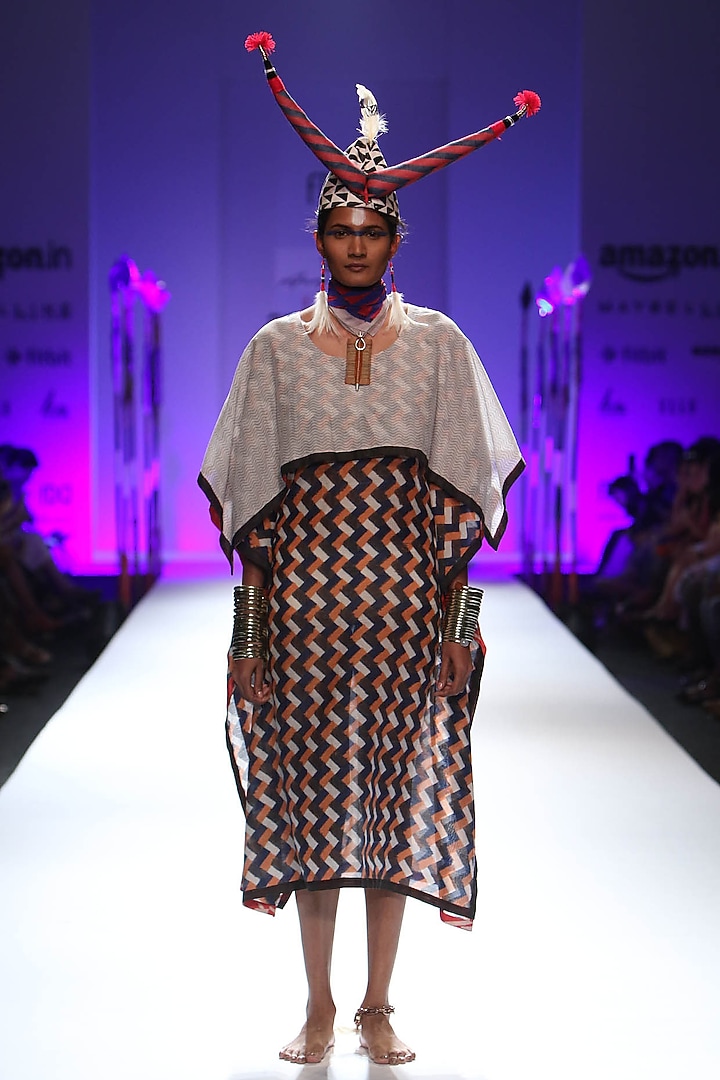 Ivory, black and orange zigzag striped kaftan dress available only at Pernia's Pop Up Shop.