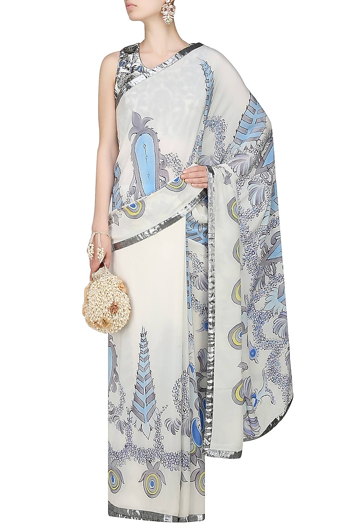 AADI SHOP by Shalini presents Off white and blue "Orchid" floral handpainted saree and embroidered blouse set available only at Pernia's Pop Up Shop.