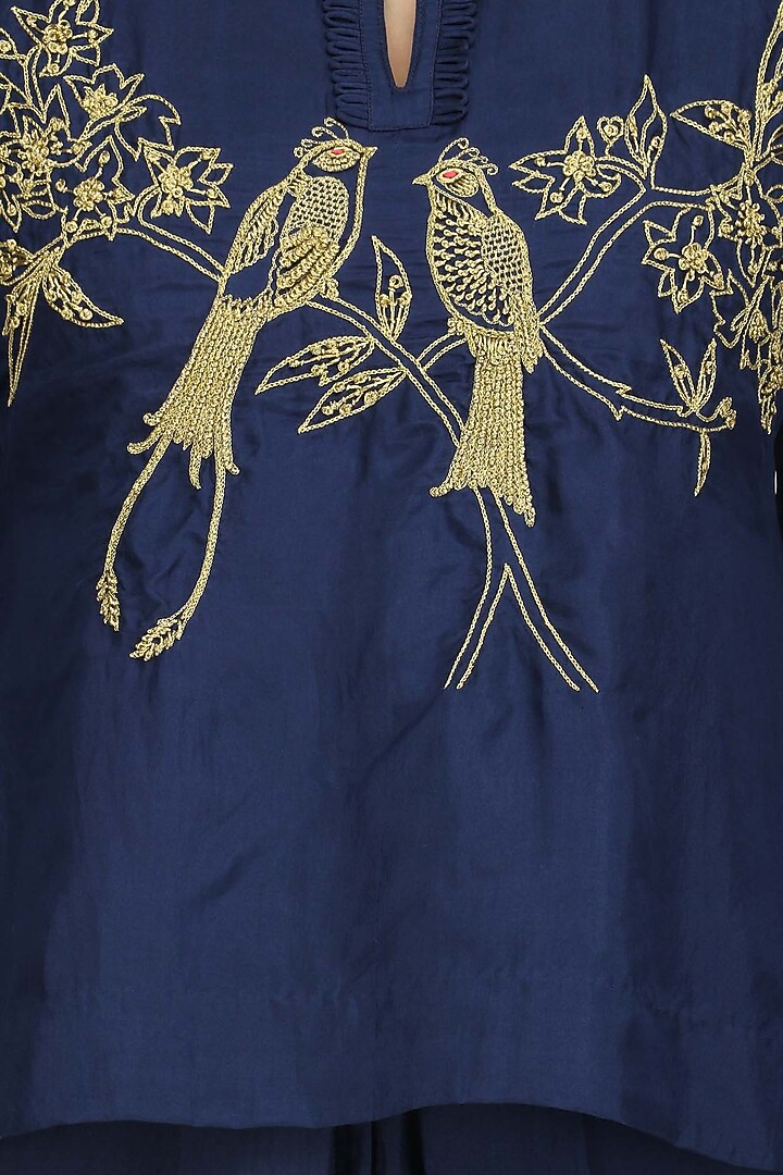 Blue floral embroidered top with asymmetric skirtavailable only at Pernia's Pop Up Shop.