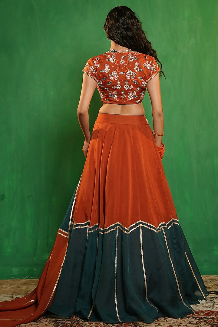 Rust & Teal Heavy Organza Embellished Wedding Lehenga Set by AHI CLOTHING at Pernia's Pop Up Shop