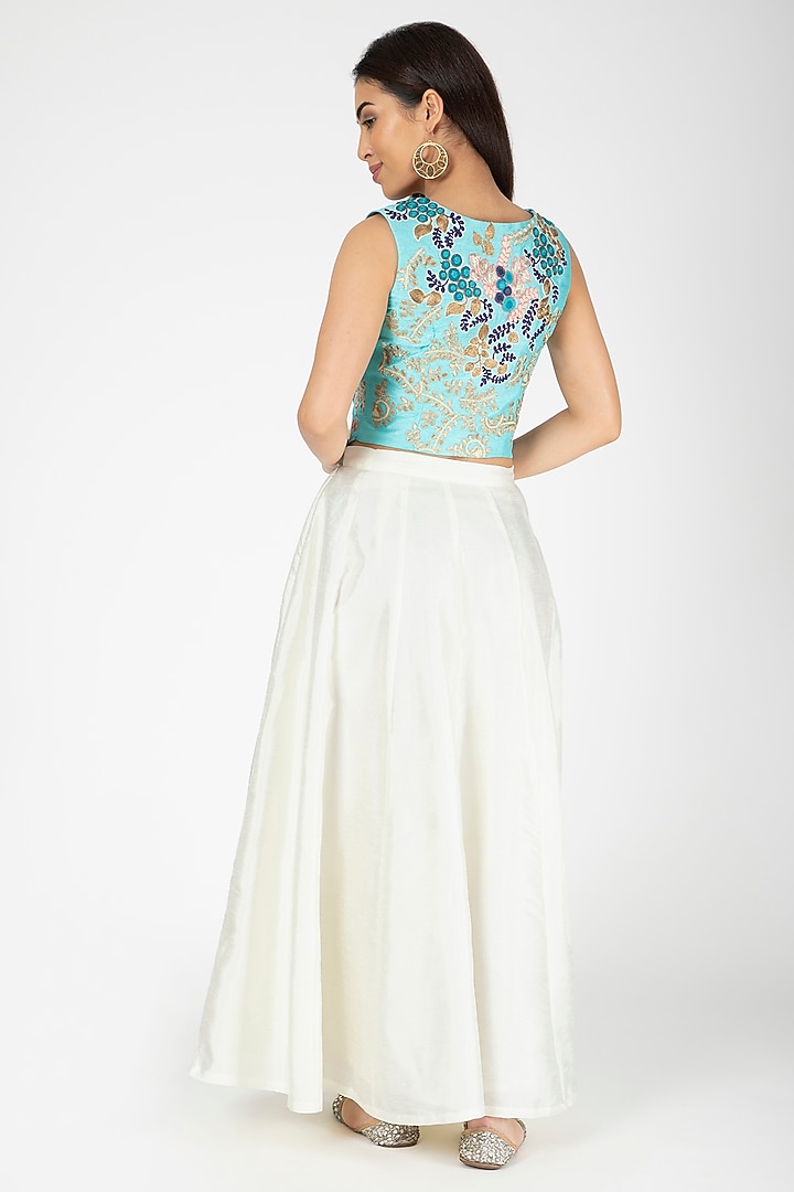 Turquoise Embroidered Jacket With White Lehenga by Aharin India at Pernia's Pop Up Shop