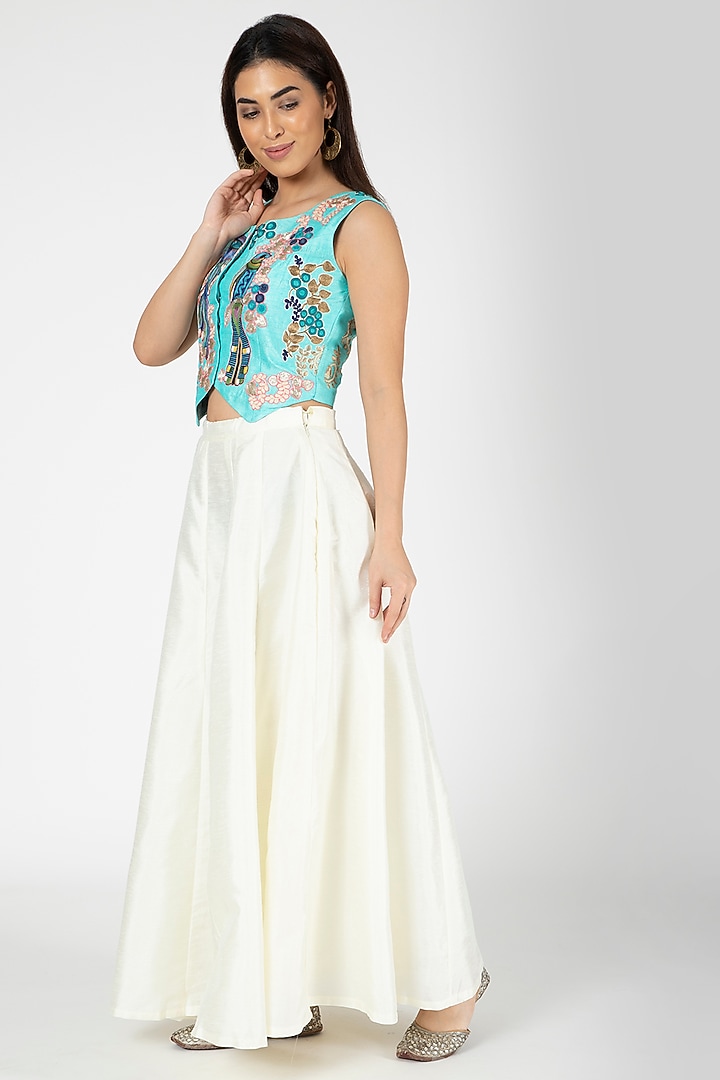 Turquoise Embroidered Jacket With White Lehenga by Aharin India at Pernia's Pop Up Shop