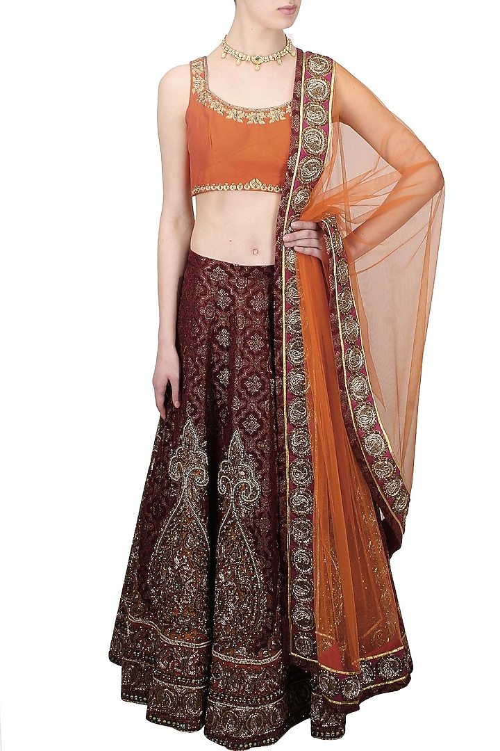 Maroon resham and zari embroidered brocade lehenga and orange blouse set available only at Pernia's Pop Up Shop.