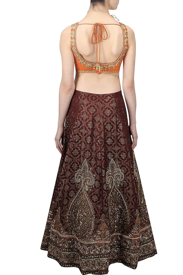 Maroon resham and zari embroidered brocade lehenga and orange blouse set available only at Pernia's Pop Up Shop.