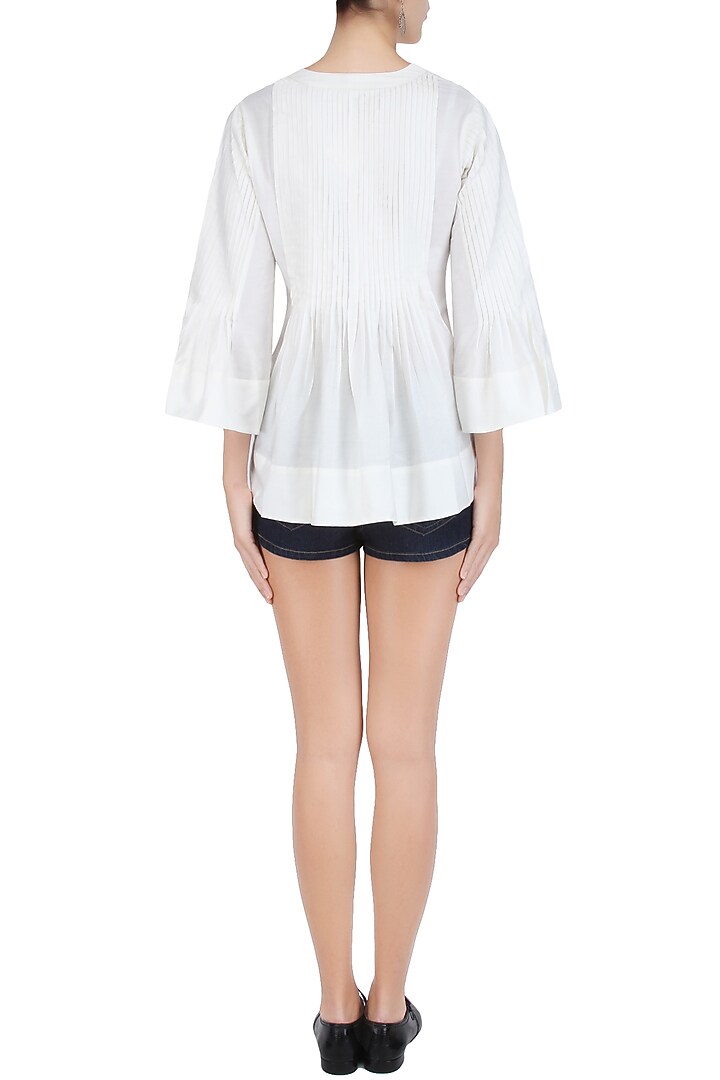 White pintucked bell sleeves top available only at Pernia's Pop Up Shop.