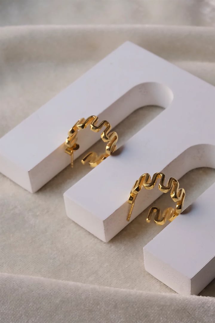 Gold Finish Hoop Earrings In Sterling Silver by Anushka Jain at Pernia's Pop Up Shop