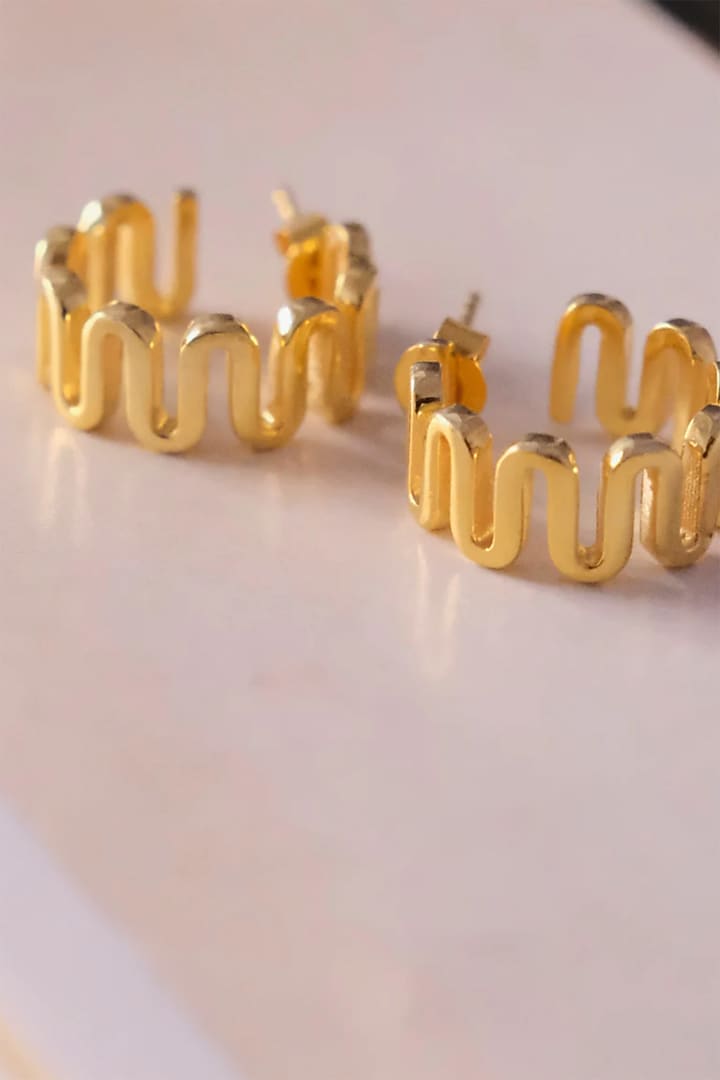 Gold Finish Hoop Earrings In Sterling Silver by Anushka Jain at Pernia's Pop Up Shop