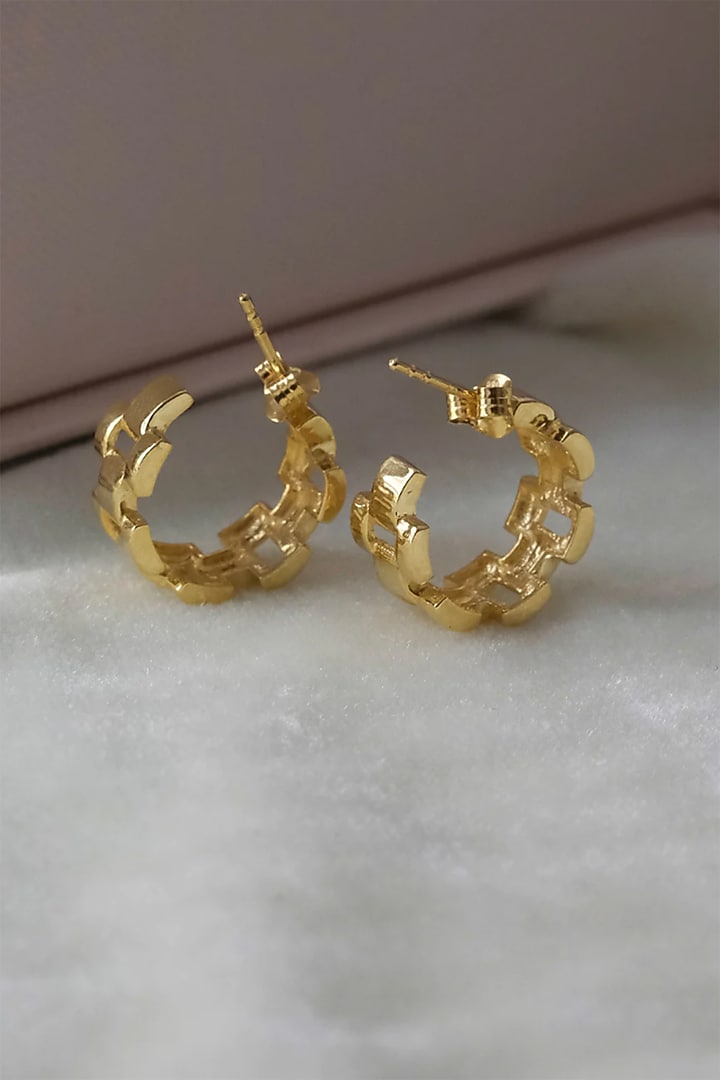 Gold Finish Hoop Earrings In Sterling Silver by Anushka Jain at Pernia's Pop Up Shop