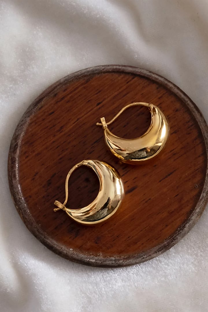 Gold Finish Hoop Earrings In Sterling Silver by Anushka Jain at Pernia's Pop Up Shop