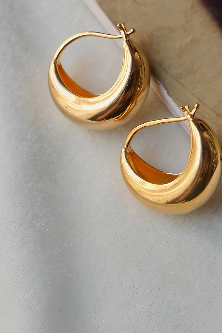 Gold Finish Hoop Earrings In Sterling Silver by Anushka Jain at Pernia's Pop Up Shop