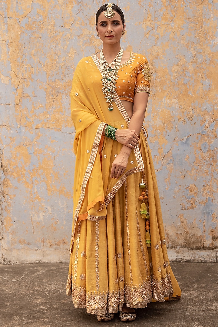 Mustard Yellow Raw Silk Marori Embroidered Lehenga Set by Apeksha Jain Label