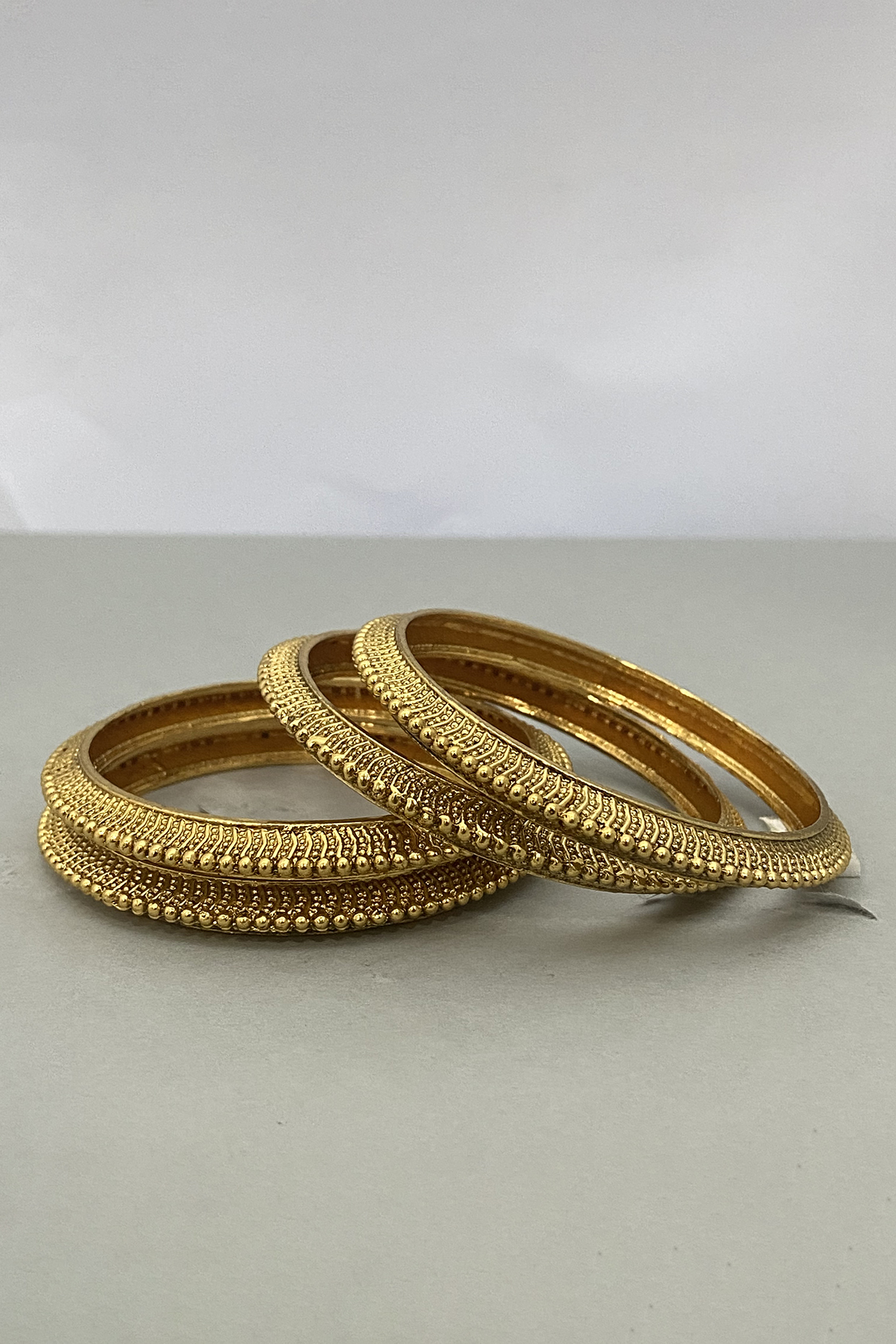 Gold Plated Bangles (Set of 4) by Anjali Jain Jewellery at Pernia's Pop Up Shop