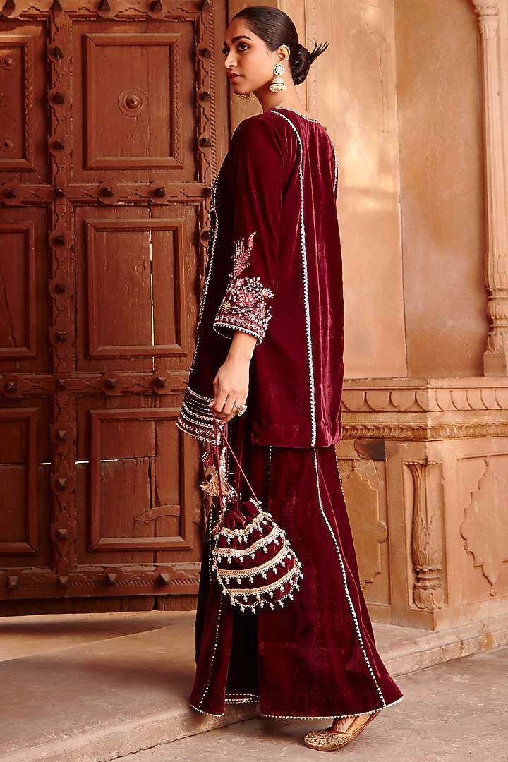 Wine half-saree, buttas and flora-fauna embroidered bordered velvet organza skirt, a matching velvet organza blouse, and a contrast embroidered scallop syska georgette dhavanif main image 0