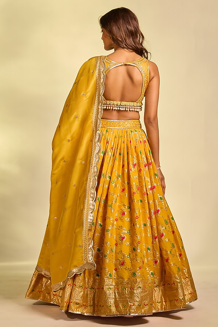 Mustard Yellow Brocade Hand Embellished Wedding Lehenga Set by AJAY & PRIYANKA at Pernia's Pop Up Shop