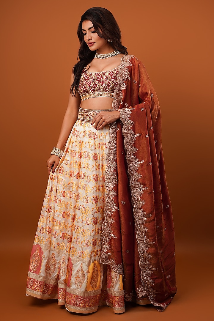 Ivory & Rust Silk Brocade Tissue Hand Embellished Wedding Lehenga Set by AJAY & PRIYANKA at Pernia's Pop Up Shop