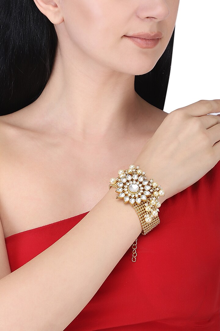 Gold plated kundan and pearls bracelet by Anjali Jain Jewellery