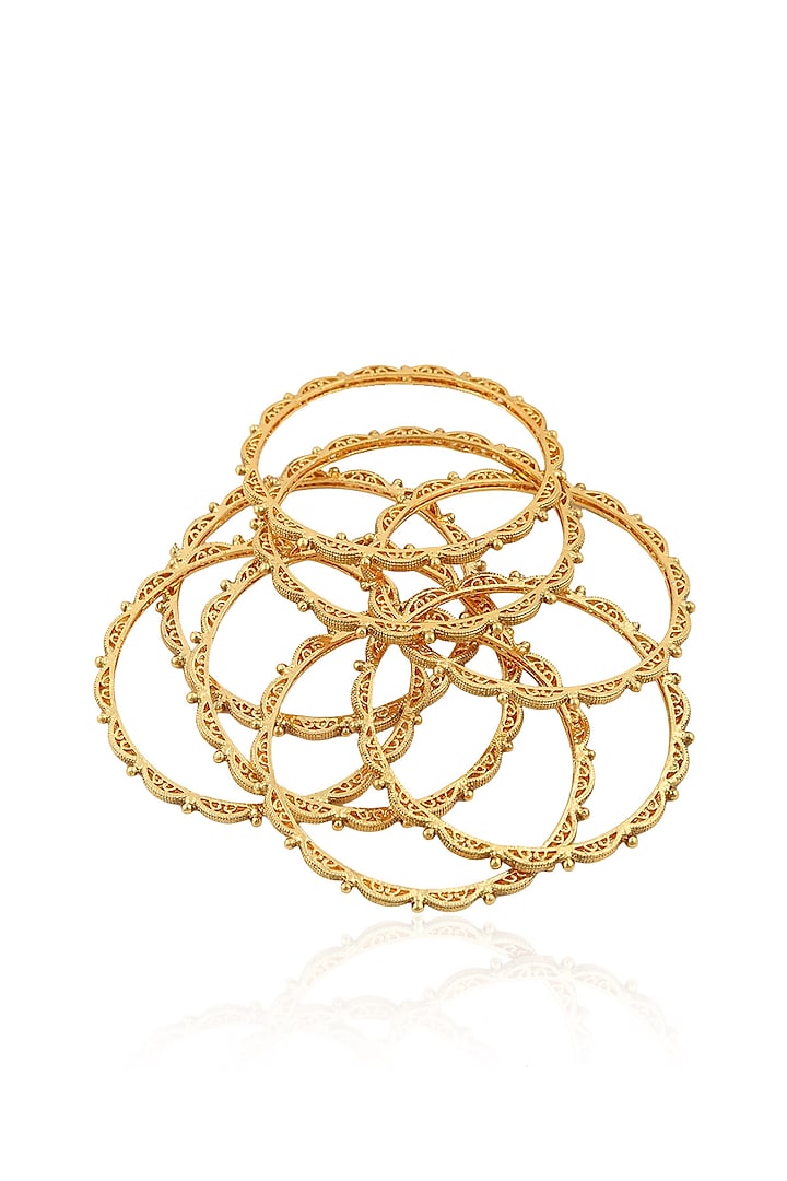 Set 0f 8 gold intricately designed bangles by Anjali Jain