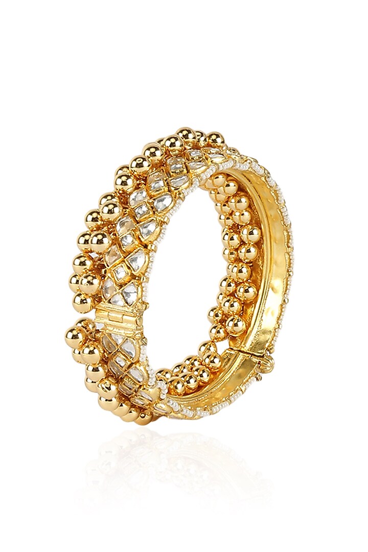 Broad gold bangle with polki & gold beads by Anjali Jain