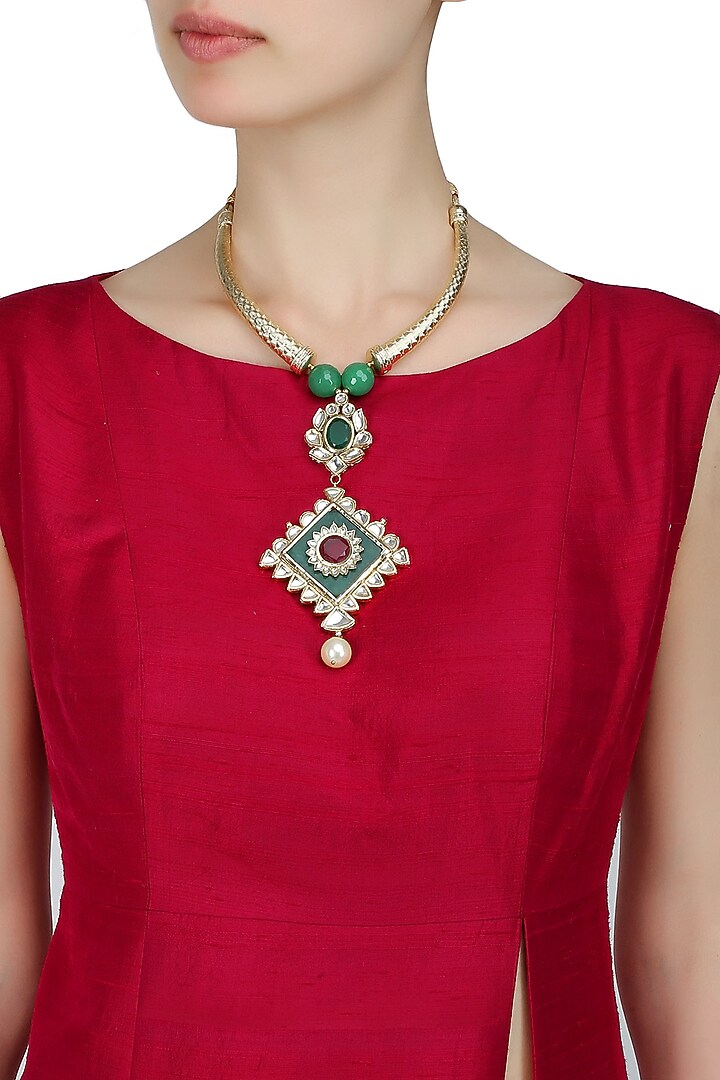 Anjali Jain presents Gold necklace with pipes with Kundan pendant with green stones available only at Pernia's Pop Up Shop.