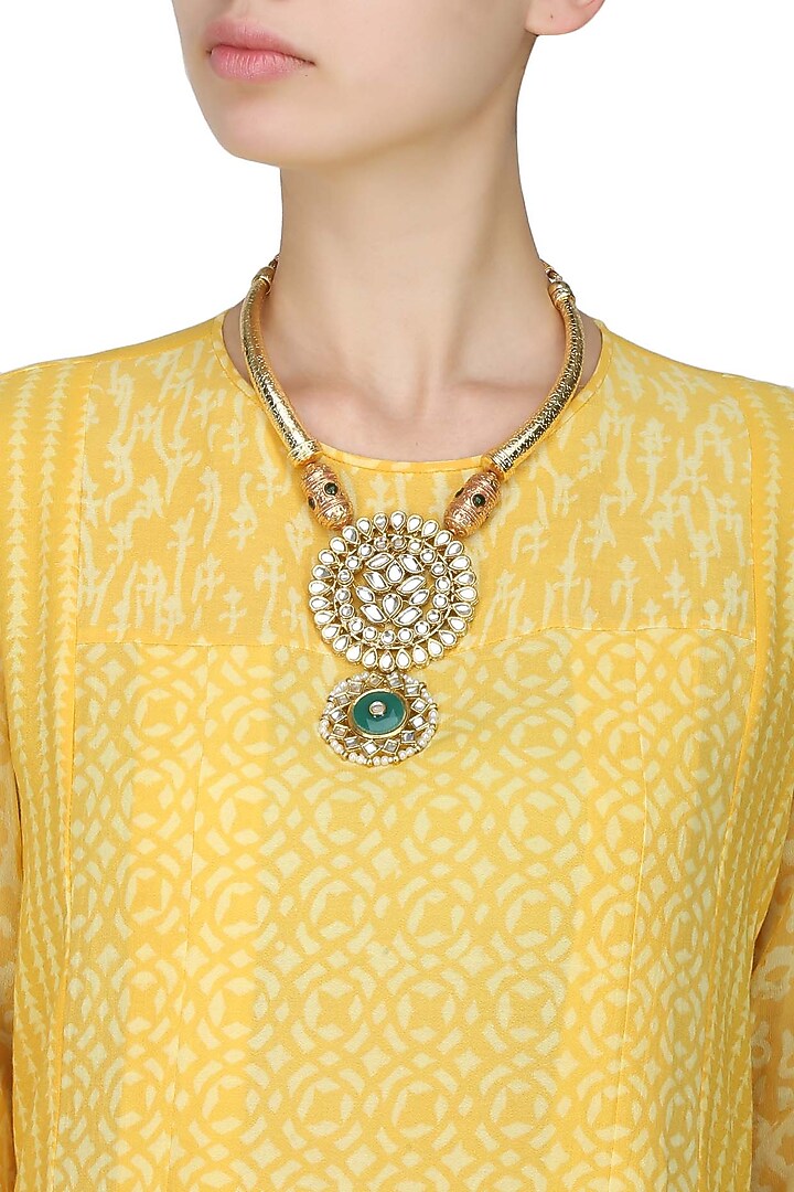 Anjali Jain presents Gold necklace with pipes with Kundan pendant with green stones available only at Pernia's Pop Up Shop.