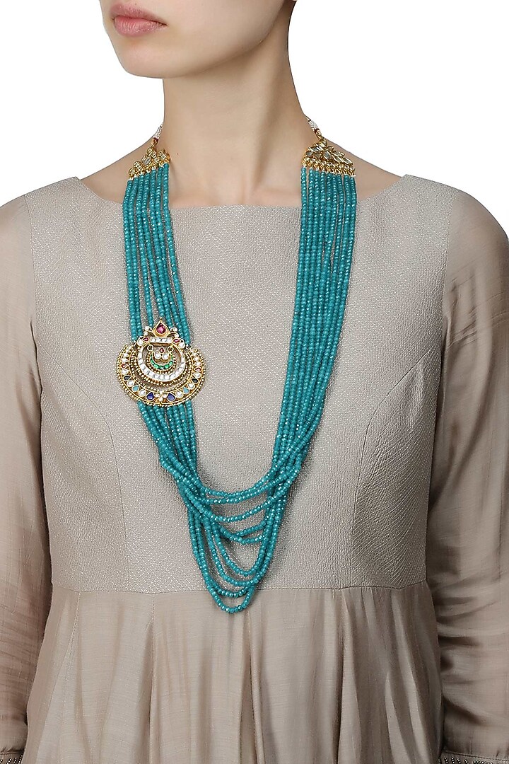 Gold necklace with blue multilayered strings with navrattan side pendant with stones , & polki