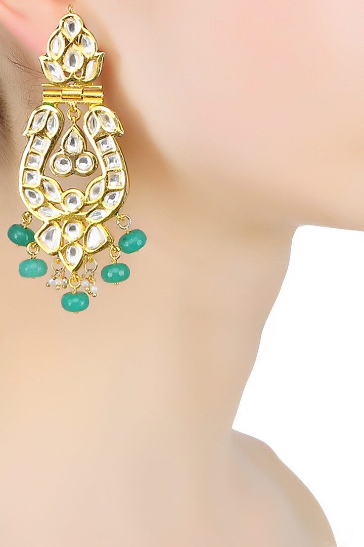 Anjali Jain presents Gold finish kundan and onyx stones peacock design earrings available only at Pernia's Pop Up Shop.