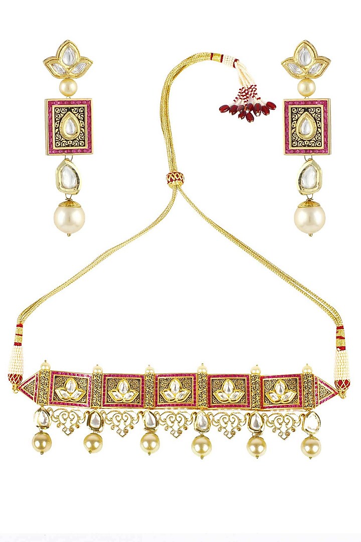 Antique gold finish textured polki and ruby choker with polki flower earrings available only at Pernia's Pop Up Shop.