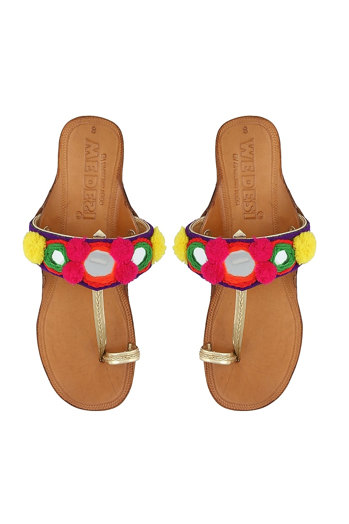 Nude kolapuri flats with multi coloured popmpoms and mirror work available only at Pernia's Pop Up Shop.