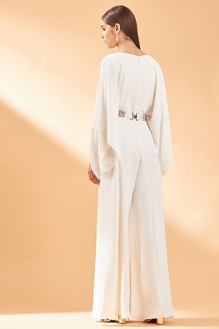 Creme Draped Jumpsuit With Belt by Aakaar at Pernia's Pop Up Shop