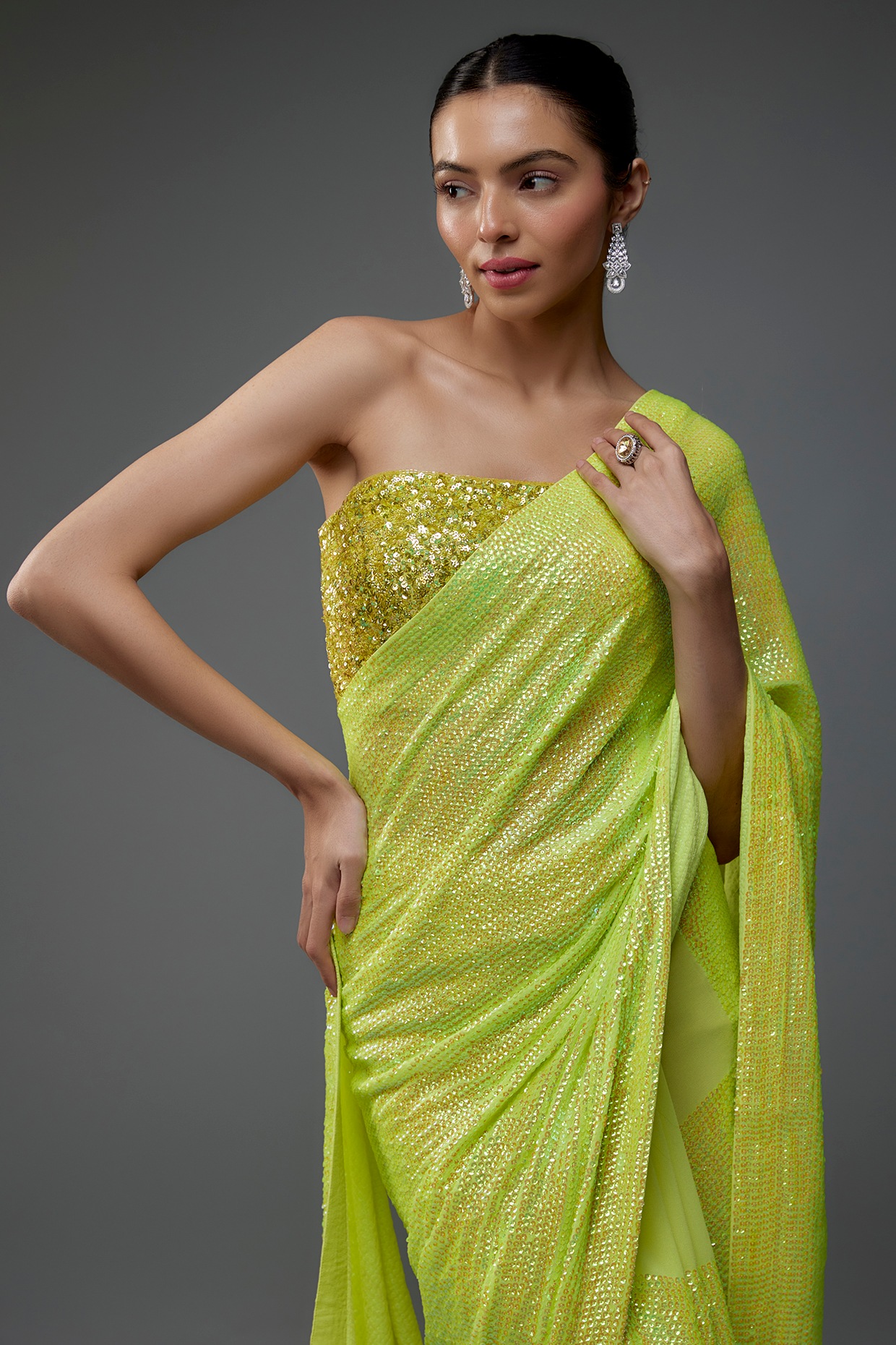 Photo of South Indian bride in a lime green saree with a purple blouse.