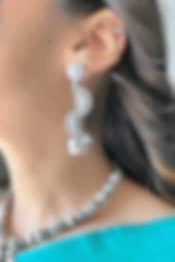 Silver Finish Kamadhenu Jhumka Earrings In Sterling Silver by Akarsaka 92.5 Silver at Pernia's Pop Up Shop