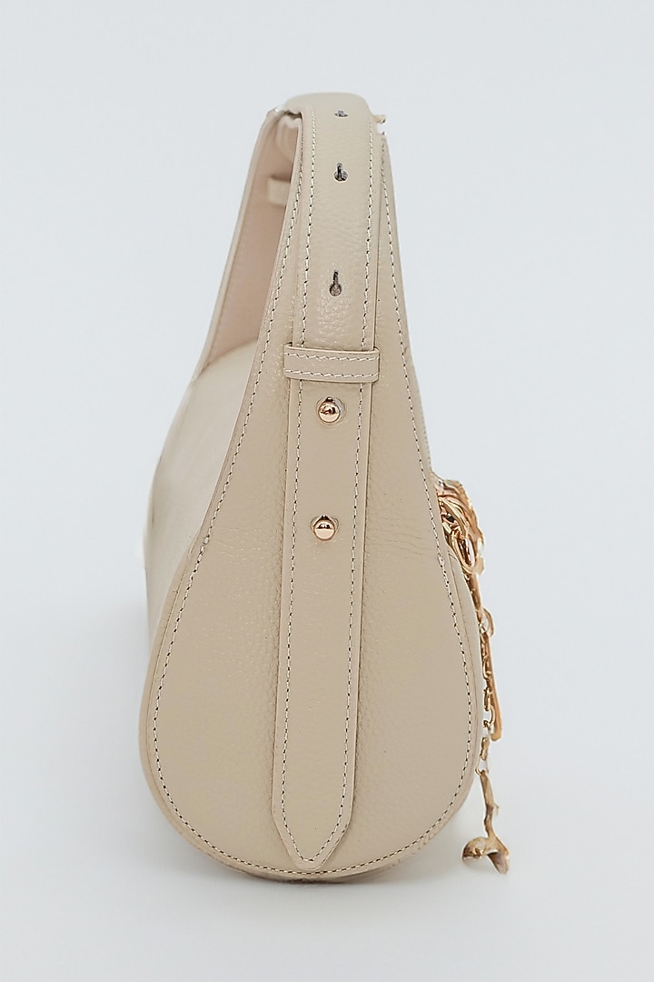 Beige Genuine Leather Metallic Embellished & Gold Embossed Bag by Akinna at Pernia's Pop Up Shop