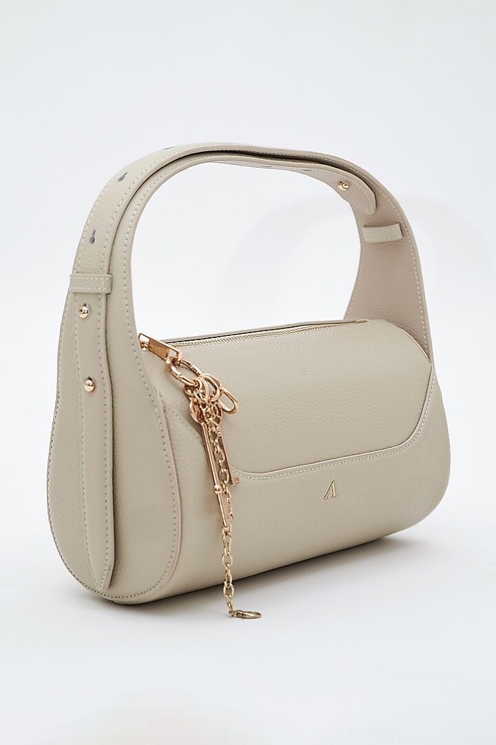 Beige Genuine Leather Metallic Embellished & Gold Embossed Bag by Akinna at Pernia's Pop Up Shop
