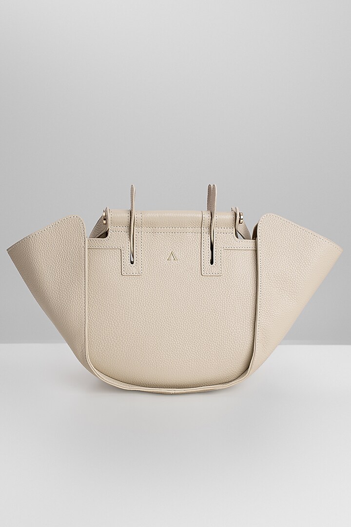 Beige Genuine Leather Metallic Embellished & Gold Embossed Bag by Akinna at Pernia's Pop Up Shop