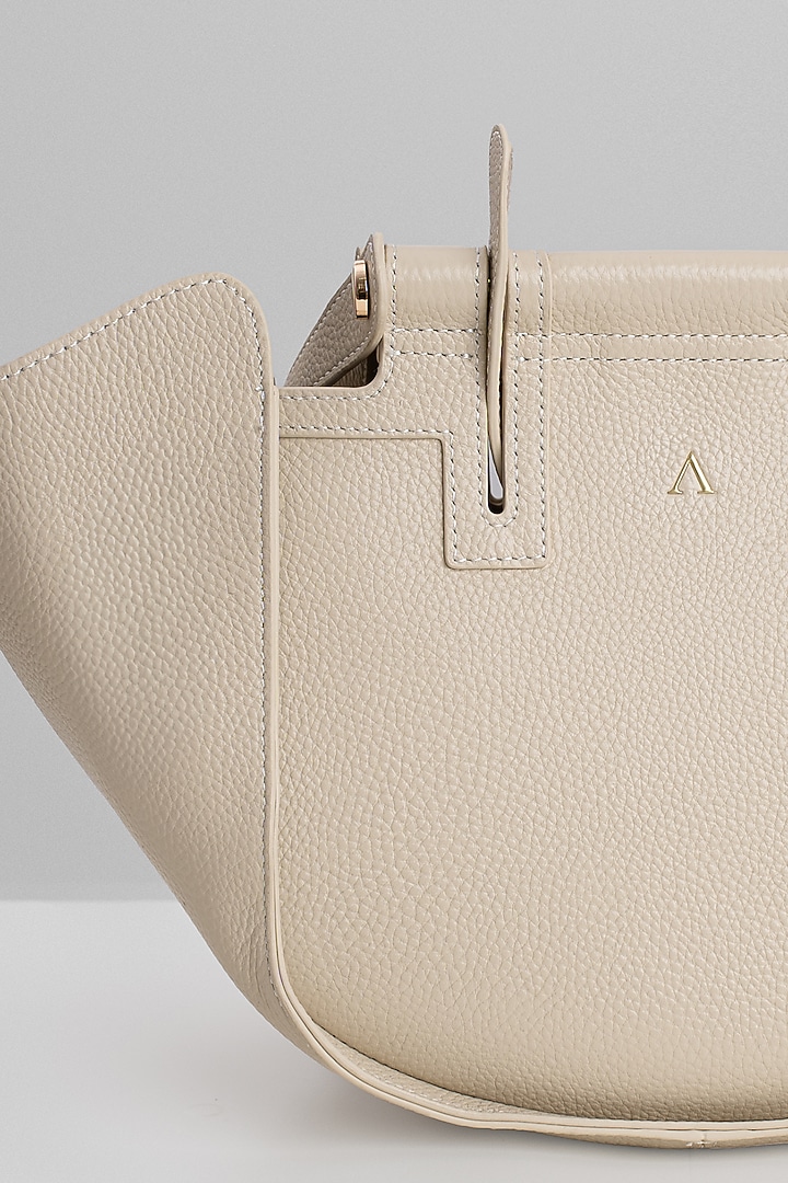 Beige Genuine Leather Metallic Embellished & Gold Embossed Bag by Akinna at Pernia's Pop Up Shop