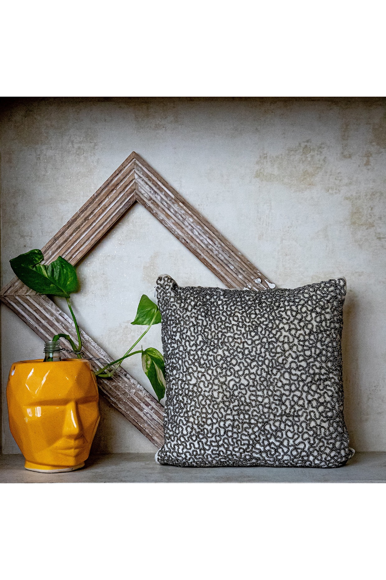 Grey beaded outlet cushion